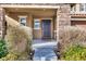 Ornate front door with sidelights and landscaping at 10597 Painted Bridge St, Las Vegas, NV 89179