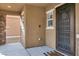 Covered porch with door and side view at 10597 Painted Bridge St, Las Vegas, NV 89179