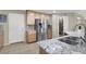 Updated kitchen with stainless steel appliances and double sink at 10597 Painted Bridge St, Las Vegas, NV 89179