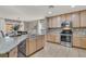 Spacious kitchen featuring granite countertops and stainless steel appliances at 10597 Painted Bridge St, Las Vegas, NV 89179