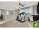 Bright loft with treadmill, window, and ceiling fan at 10597 Painted Bridge St, Las Vegas, NV 89179