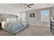 Main bedroom with plush bed and neutral decor at 10597 Painted Bridge St, Las Vegas, NV 89179