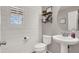 Charming powder room with shiplap walls and a pedestal sink at 10597 Painted Bridge St, Las Vegas, NV 89179