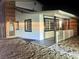 Night view of charming home with updated facade and landscaping at 116 W Victory Rd, Henderson, NV 89015