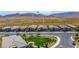 Aerial shot of modern homes at 12457 Heritage Bend Dr, surrounded by desert landscaping at 12457 Heritage Bend Dr, Las Vegas, NV 89138