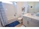 Clean bathroom with tub, sleek vanity, framed art, and modern fixtures at 12457 Heritage Bend Dr, Las Vegas, NV 89138