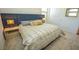 Bright bedroom featuring a plush bed with stylish pillows and lamps on nightstands at 12457 Heritage Bend Dr, Las Vegas, NV 89138