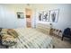 Well-lit bedroom with cactus wall art, comfortable bedding, and ample closet space at 12457 Heritage Bend Dr, Las Vegas, NV 89138