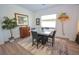 Dining room showcases a square table with modern decor and neutral tones at 12457 Heritage Bend Dr, Las Vegas, NV 89138