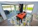 Dining room featuring modern light fixture, bright colors, and outdoor access at 12457 Heritage Bend Dr, Las Vegas, NV 89138