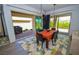 Dining room featuring modern light fixtures and sliding glass doors to outdoor patio at 12457 Heritage Bend Dr, Las Vegas, NV 89138