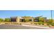 Contemporary building exterior with professional landscaping, brick-paved parking entry at 12457 Heritage Bend Dr, Las Vegas, NV 89138