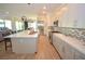 Bright kitchen with an island, stainless steel appliances, and modern backsplash at 12457 Heritage Bend Dr, Las Vegas, NV 89138