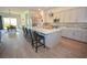 Spacious kitchen with an island, seating, stainless appliances, and open layout at 12457 Heritage Bend Dr, Las Vegas, NV 89138