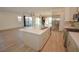 Spacious open kitchen with island, modern appliances, and a seamless flow into the living areas at 12457 Heritage Bend Dr, Las Vegas, NV 89138