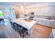 Modern kitchen boasts an island, stainless steel appliances, and sleek pendant lights at 12457 Heritage Bend Dr, Las Vegas, NV 89138