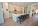 Modern kitchen features a large island with seating and stainless steel appliances at 12457 Heritage Bend Dr, Las Vegas, NV 89138