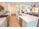Elegant kitchen features a large island, stainless steel appliances, and pendant lighting at 12457 Heritage Bend Dr, Las Vegas, NV 89138