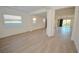Bright living room features light wood floors and multiple windows at 12457 Heritage Bend Dr, Las Vegas, NV 89138