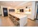 Spacious lounge with a marble countertop, stylish stools, and modern decor at 12457 Heritage Bend Dr, Las Vegas, NV 89138