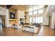 Elegant lounge area with modern sofas, stylish lighting, and a cozy fireplace at 12457 Heritage Bend Dr, Las Vegas, NV 89138
