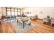 Spacious office area featuring hardwood floors, modern furniture, and bright natural light at 12457 Heritage Bend Dr, Las Vegas, NV 89138