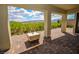 Covered patio with stone pavers and desert views at 12457 Heritage Bend Dr, Las Vegas, NV 89138