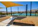 Community tennis court with shade and benches at 12457 Heritage Bend Dr, Las Vegas, NV 89138