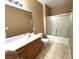 Bathroom with shower/tub combo and wood vanity at 1350 Crystal Hill Ln # 3, Henderson, NV 89012