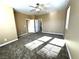 Large bedroom with carpet flooring, ceiling fan, and access to bathroom at 1350 Crystal Hill Ln # 3, Henderson, NV 89012