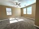 Spacious bedroom with two windows and ceiling fan at 1350 Crystal Hill Ln # 3, Henderson, NV 89012