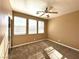 Well-lit bedroom with three windows and ceiling fan at 1350 Crystal Hill Ln # 3, Henderson, NV 89012