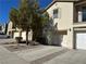 Townhouse exterior with attached garage and driveway at 1350 Crystal Hill Ln # 3, Henderson, NV 89012