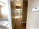 Long hallway with light brown wood flooring at 1350 Crystal Hill Ln # 3, Henderson, NV 89012