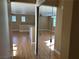 Long hallway with mirrored closet doors and views of living spaces at 1350 Crystal Hill Ln # 3, Henderson, NV 89012