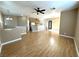 Bright living room with laminate wood floors and a view into the kitchen at 1350 Crystal Hill Ln # 3, Henderson, NV 89012