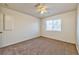 Bright bedroom with ceiling fan and plush carpeting at 1605 Calle Montery St, Las Vegas, NV 89117