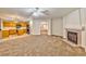 Living room with a fireplace and an open kitchen view at 1605 Calle Montery St, Las Vegas, NV 89117