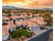 Single-story home with a two-car garage and lush landscaping at 1613 Shadow Rock Dr, Las Vegas, NV 89117