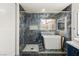 Bathroom with a walk-in shower and marble tile at 1613 Shadow Rock Dr, Las Vegas, NV 89117