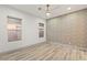 Bright bedroom with wood-look floors and accent wall at 1613 Shadow Rock Dr, Las Vegas, NV 89117