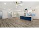 Modern kitchen with large island and blue cabinetry at 1613 Shadow Rock Dr, Las Vegas, NV 89117