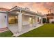 Covered patio with ceiling fan, adjacent to grassy backyard at 1613 Shadow Rock Dr, Las Vegas, NV 89117