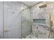 Modern shower with glass enclosure and marble tile at 1613 Shadow Rock Dr, Las Vegas, NV 89117