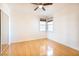 Well-lit bedroom featuring hardwood floors and a mirrored closet at 1830 N Buffalo Dr # 2095, Las Vegas, NV 89128