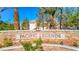 Entrance sign for Pacific Legends Condos displayed with lush landscaping at 1830 N Buffalo Dr # 2095, Las Vegas, NV 89128