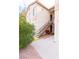 Exterior shot of condo showing stairs, small patio area and some landscaping at 1830 N Buffalo Dr # 2095, Las Vegas, NV 89128