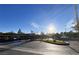 Exterior parking area for the condo complex with blue sky overhead at 1830 N Buffalo Dr # 2095, Las Vegas, NV 89128