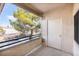 Balcony with view of trees and covered parking at 1830 N Buffalo Dr # 2095, Las Vegas, NV 89128