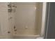 Bathroom with a shower/tub combo and tiled walls at 2007 Cutlass Dr # 0, Henderson, NV 89014